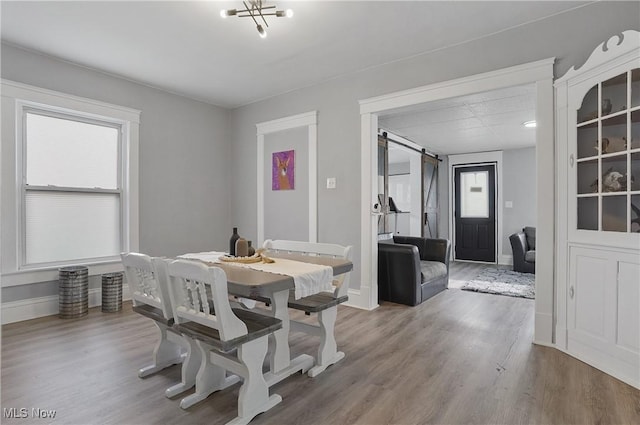 288 College St, Wadsworth, OH 44281 - dining area featuring baseboards, plenty of natural light, and wood finished floors