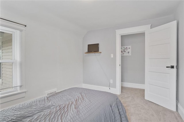 288 College St, Wadsworth, OH 44281 - carpeted bedroom featuring visible vents, baseboards, and vaulted ceiling