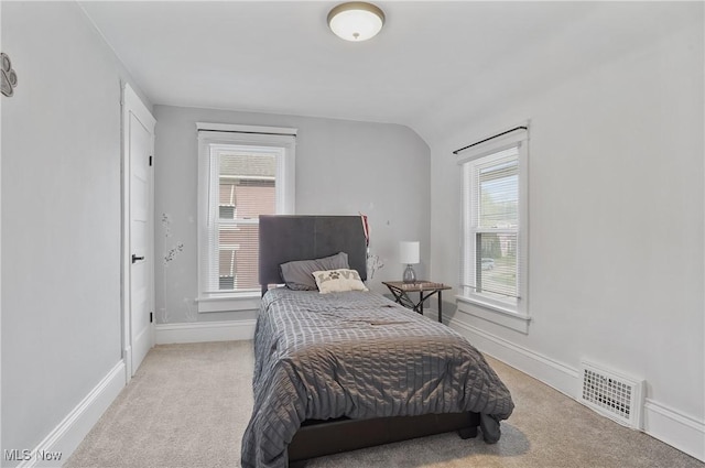 288 College St, Wadsworth, OH 44281 - bedroom featuring multiple windows, light colored carpet, and visible vents