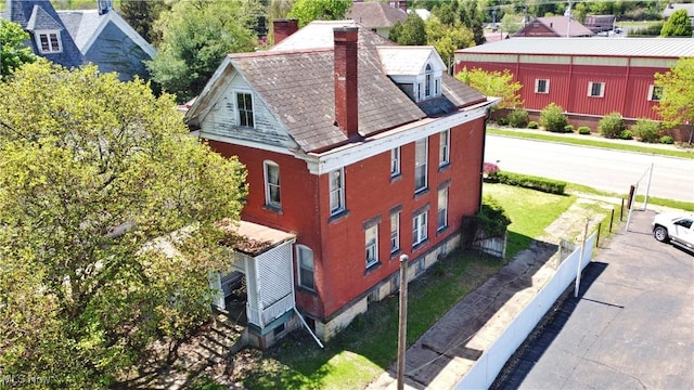 view of property exterior featuring a chimney