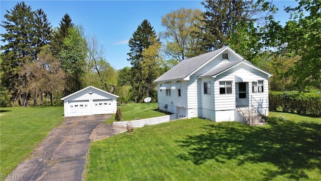 view of side of home featuring a garage, an outbuilding, and a yard