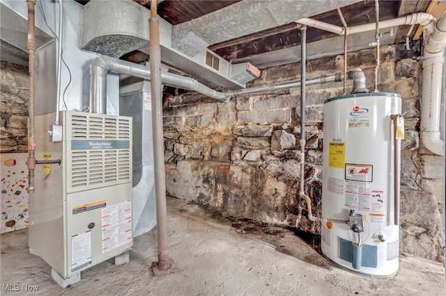 utility room featuring heating unit and gas water heater