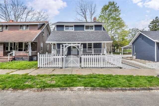 838 N Lincoln Ave, Alliance, OH 44601 - view of front facade with fence private yard, a shingled roof, covered porch, and a chimney