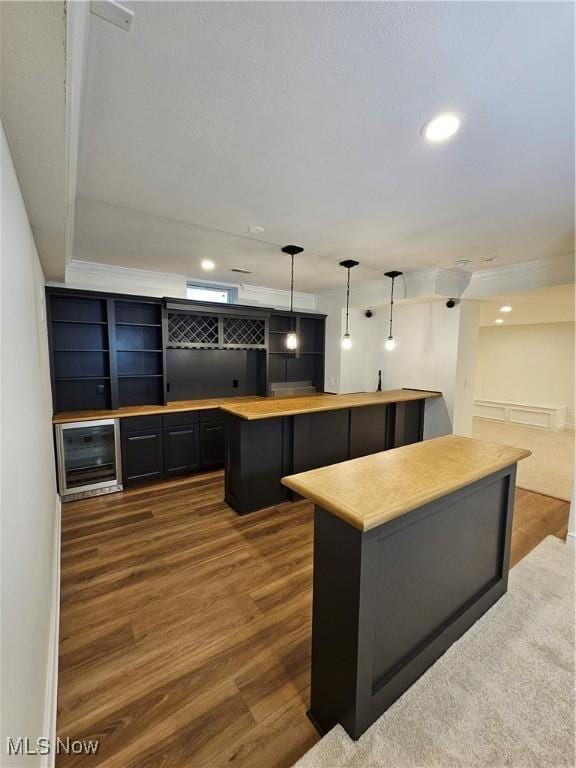 bar with wine cooler, recessed lighting, pendant lighting, and dark wood-style flooring