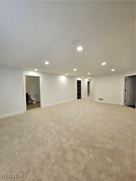 finished basement featuring recessed lighting, carpet, baseboards, and visible vents