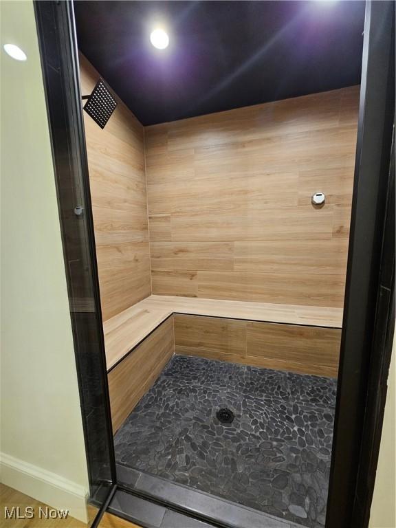 view of sauna / steam room with recessed lighting and baseboards