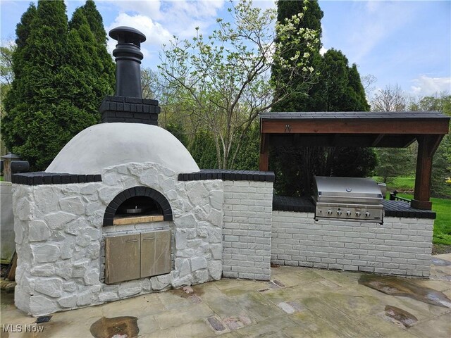 view of patio with exterior kitchen and area for grilling