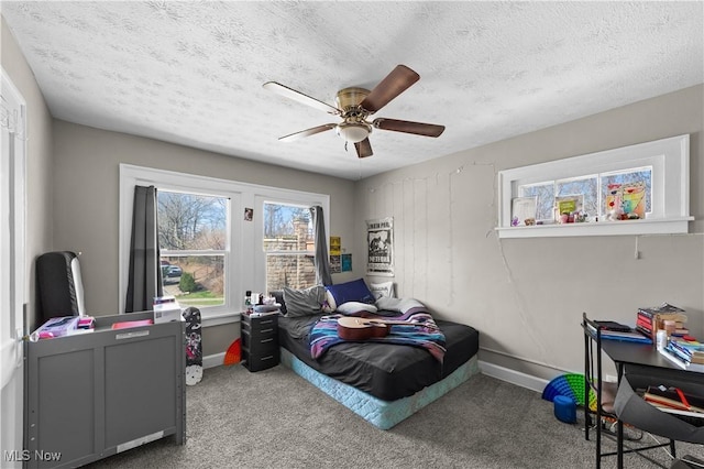 1335 W Blvd, Cleveland, OH 44102 - carpeted bedroom with baseboards, a ceiling fan, and a textured ceiling