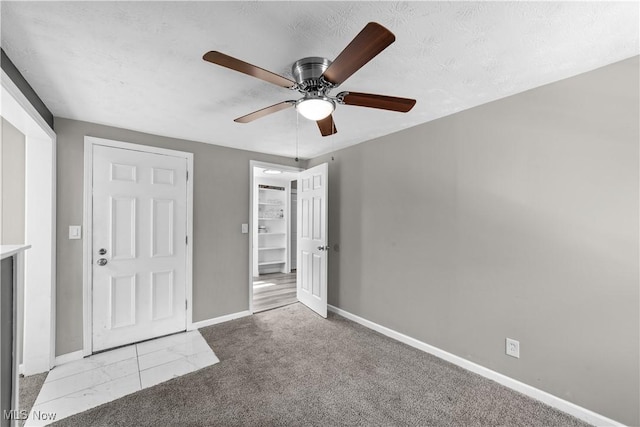 1335 W Blvd, Cleveland, OH 44102 - unfurnished bedroom featuring carpet floors, baseboards, and ceiling fan
