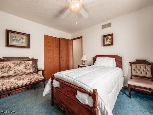 carpeted bedroom featuring visible vents, a ceiling fan, and a closet