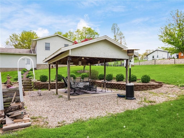 surrounding community with a gazebo, a patio area, and a yard