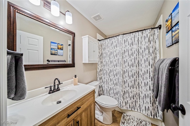 bathroom featuring visible vents, tile patterned flooring, curtained shower, vanity, and toilet