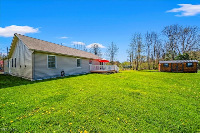 exterior space with an outbuilding and a deck