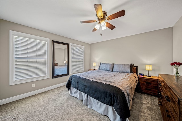 bedroom featuring baseboards, multiple windows, ceiling fan, and carpet