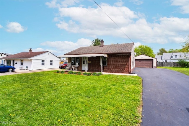 7377 Sierra Madre Trl, Boardman, OH 44512 - ranch-style house with a detached garage, fence, and a front lawn