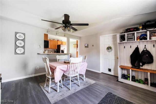 7377 Sierra Madre Trl, Boardman, OH 44512 - dining space featuring dark wood-style flooring, baseboards, and a ceiling fan