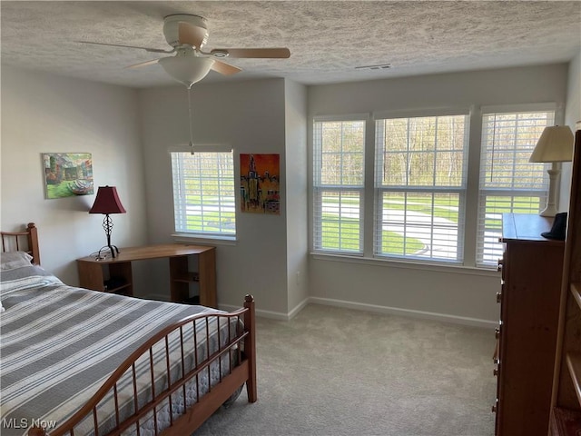 840 Sunrise Cir, Aurora, OH 44202 - bedroom with a textured ceiling, baseboards, and multiple windows