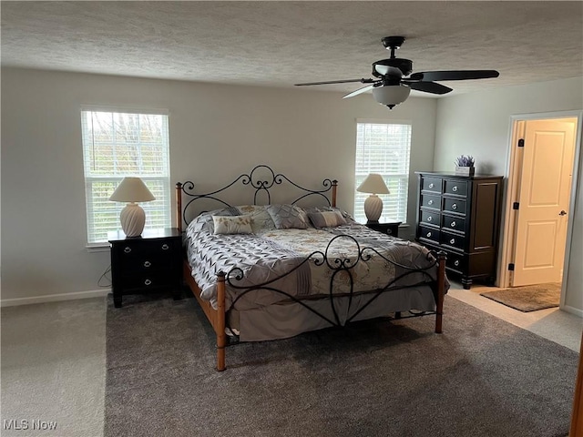 840 Sunrise Cir, Aurora, OH 44202 - carpeted bedroom with baseboards, a ceiling fan, and a textured ceiling