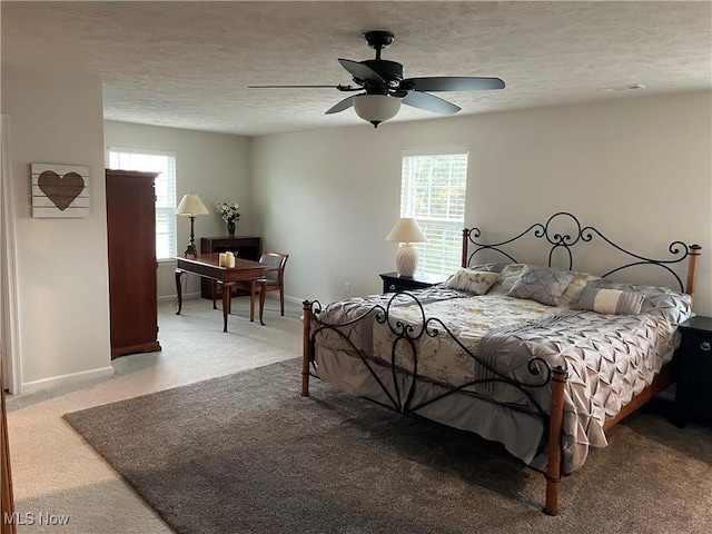 840 Sunrise Cir, Aurora, OH 44202 - carpeted bedroom featuring baseboards, a ceiling fan, and a textured ceiling