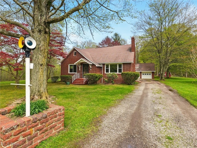 bungalow-style home with a garage, a front lawn, a chimney, brick siding, and driveway