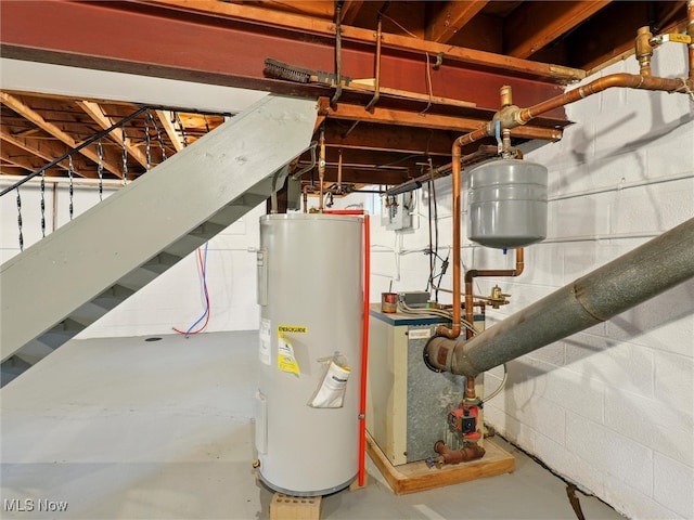 utility room with a heating unit and electric water heater