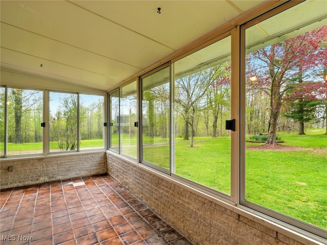 unfurnished sunroom with a healthy amount of sunlight