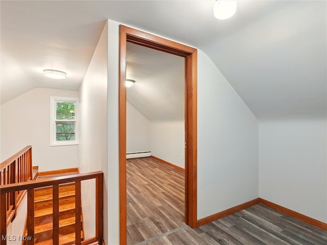 bonus room featuring baseboards, a baseboard radiator, vaulted ceiling, and dark wood-style floors