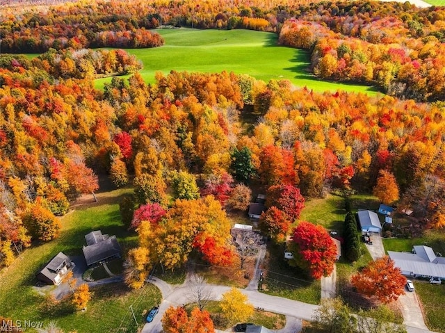 aerial view with a view of trees and golf course view