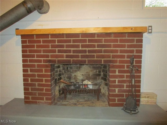 details with a brick fireplace
