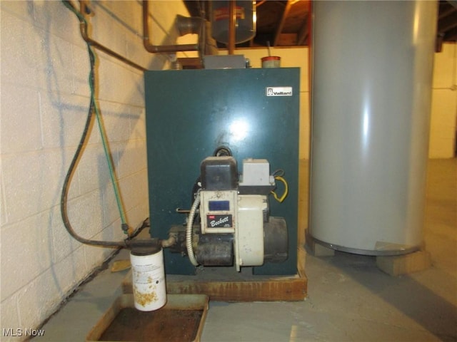 utility room featuring water heater