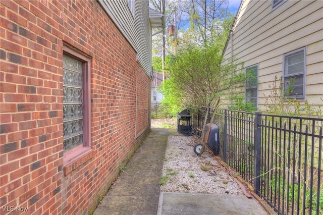 24118 E Baintree Rd, Beachwood, OH 44122 - view of side of home featuring fence and brick siding