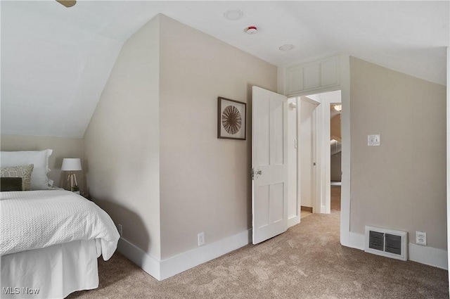 460 Carthage Ave, Kent, OH 44240 - bedroom featuring baseboards, light colored carpet, lofted ceiling, and visible vents