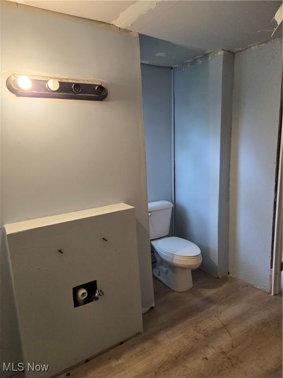 413 Henry St, Mansfield, OH 44907 - bathroom with toilet and wood finished floors