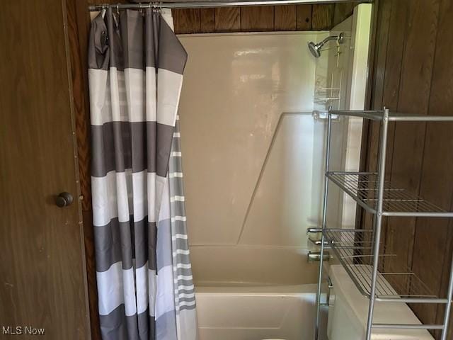full bath featuring shower / tub combo with curtain