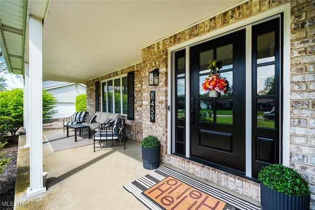 8459 Four Seasons Trl, Poland, OH 44514 - entrance to property with brick siding, covered porch, and stone siding