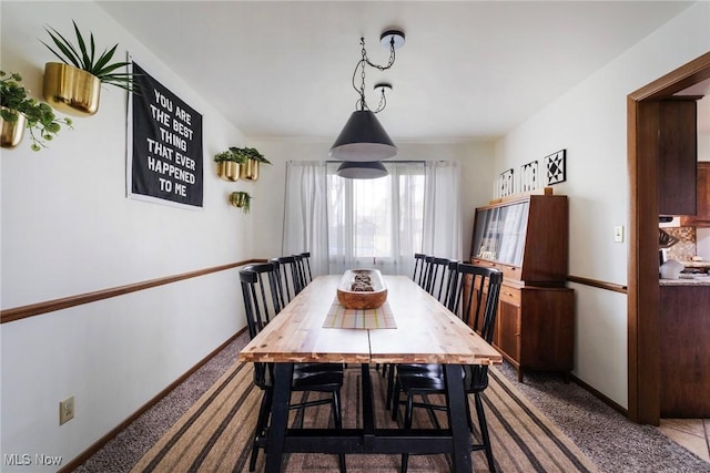8459 Four Seasons Trl, Poland, OH 44514 - carpeted dining area featuring baseboards