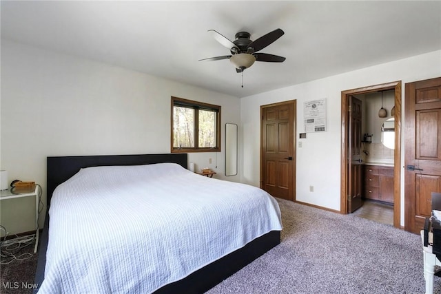 8459 Four Seasons Trl, Poland, OH 44514 - carpeted bedroom featuring baseboards, ceiling fan, and ensuite bath