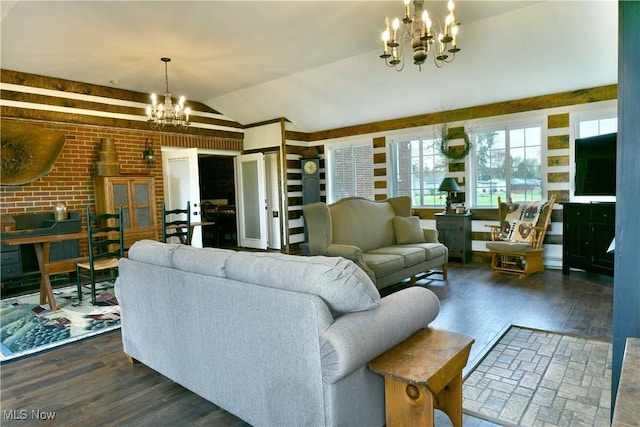 living area featuring baseboard heating, lofted ceiling, dark wood-style flooring, and a chandelier