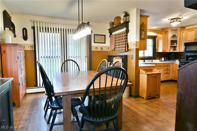 dining space with light wood-type flooring