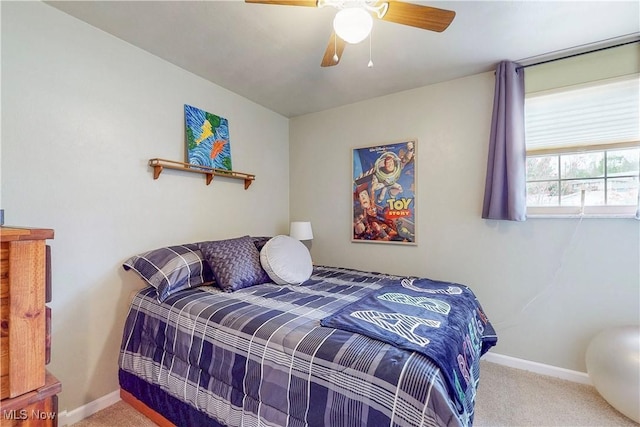 bedroom with baseboards, a ceiling fan, and carpet