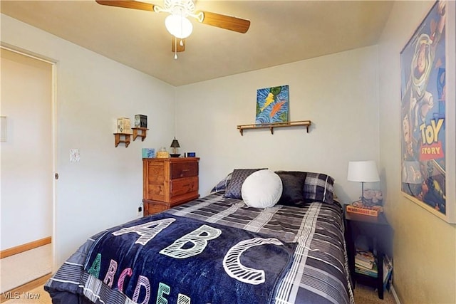 bedroom with carpet flooring, a ceiling fan, and baseboards