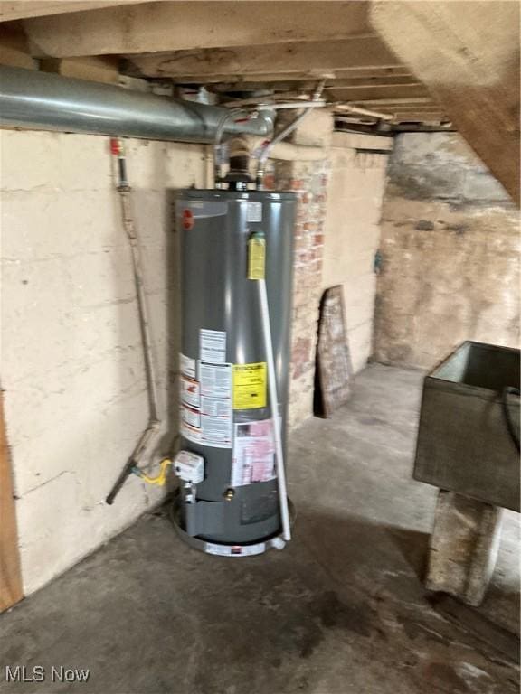 utility room featuring water heater