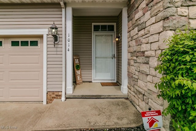 doorway to property featuring stone siding