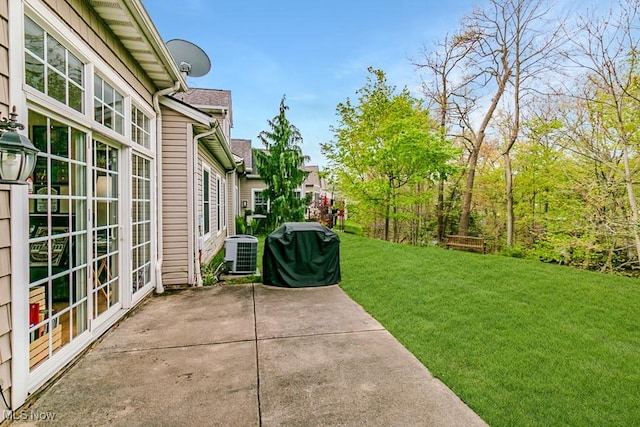 view of yard with a patio area and central AC