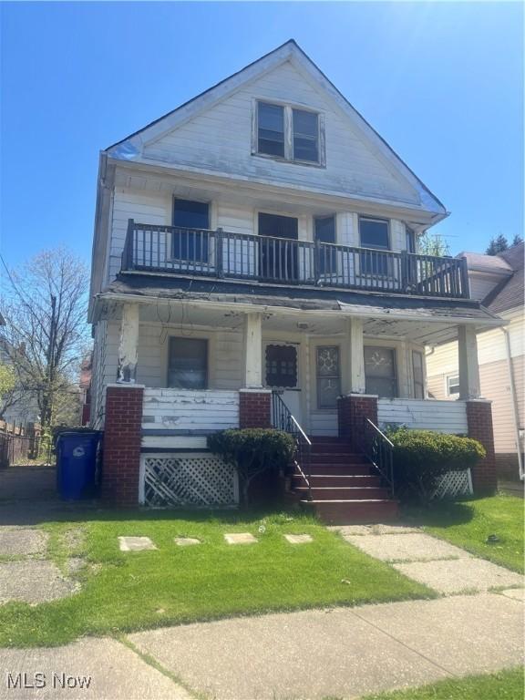 2897 E 117th St, Cleveland, OH 44120 - view of front of property with covered porch and a balcony