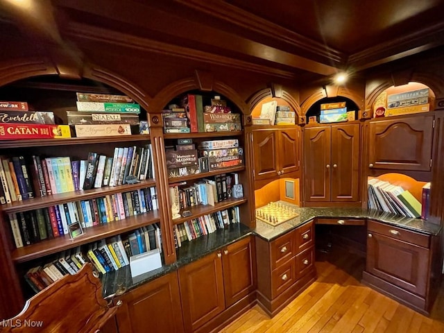office space featuring ornamental molding and light wood finished floors
