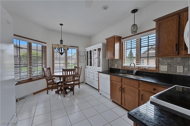 kitchen with an inviting chandelier, a sink, plenty of natural light, and dishwasher