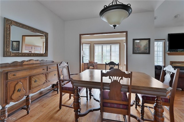 dining space featuring light wood-type flooring