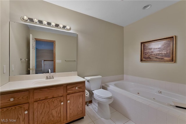bathroom with a whirlpool tub, tile patterned floors, toilet, and vanity