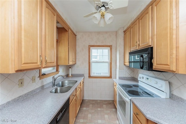 kitchen with light brown cabinetry, a sink, light countertops, a ceiling fan, and black appliances